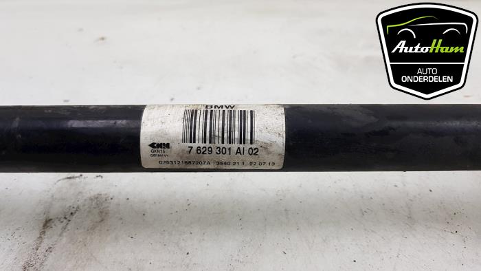 Drive shaft, rear left from a BMW 1 serie (F20) 114i 1.6 16V 2014