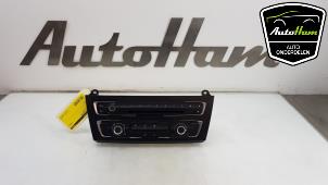 Usados Panel de control de calefacción BMW 1 serie (F20) 114d 1.6 16V Precio € 100,00 Norma de margen ofrecido por AutoHam