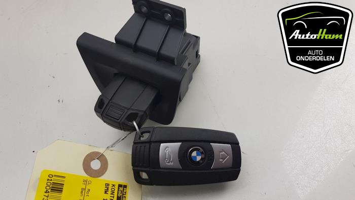 Ignition lock + key from a BMW 1 serie (E87/87N) 116i 2.0 16V 2011