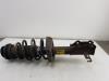 Fronts shock absorber, left from a Opel Zafira Tourer (P12) 1.4 Turbo 16V Ecotec 2013