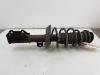 Fronts shock absorber, left from a Opel Zafira Tourer (P12) 1.4 Turbo 16V Ecotec 2013