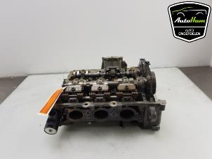 Used Cylinder head BMW 1 serie (F40) 118i 1.5 TwinPower 12V Price on request offered by AutoHam