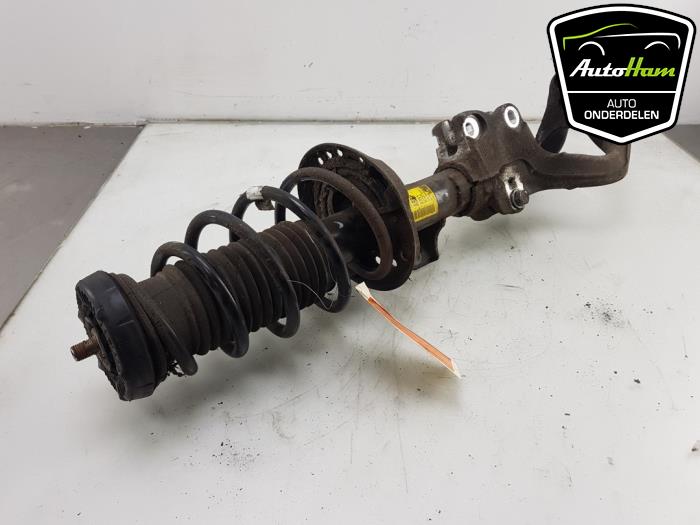 Fronts shock absorber, left from a Opel Astra J GTC (PD2/PF2) 1.4 Turbo 16V ecoFLEX 140 2012