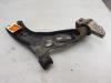 Front wishbone, left from a Volkswagen Touran (1T3) 1.6 TDI 16V 2015