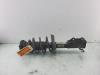 Fronts shock absorber, left from a Opel Astra J Sports Tourer (PD8/PE8/PF8) 1.4 Turbo 16V 2014