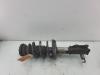 Fronts shock absorber, left from a Opel Astra J Sports Tourer (PD8/PE8/PF8) 1.4 Turbo 16V 2014