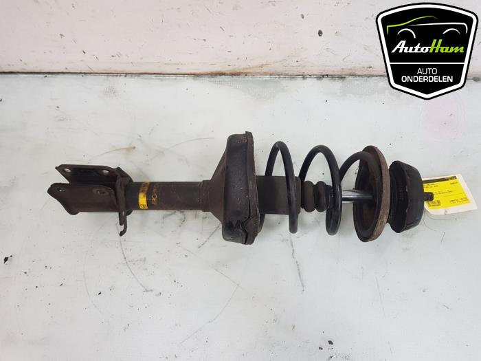 Fronts shock absorber, left from a Renault Twingo II (CN) 1.2 16V 2012