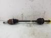 Front drive shaft, left from a Toyota Yaris II (P9) 1.33 16V Dual VVT-I 2009