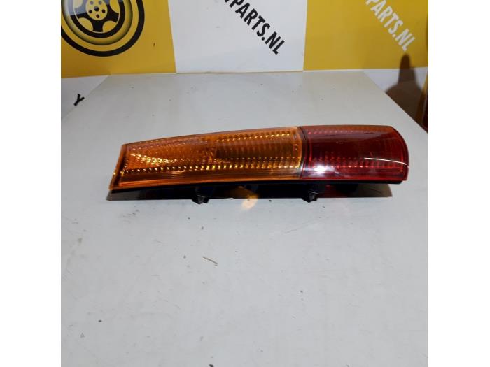 Taillight, left from a Suzuki New Ignis (MH) 1.3 16V 2006