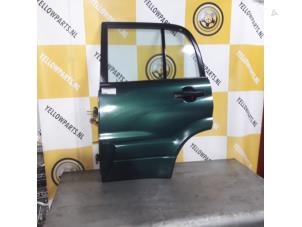Używane Drzwi lewe tylne wersja 4-drzwiowa Suzuki Grand Vitara I (FT/GT/HT) 2.0 16V Cena € 75,00 Procedura marży oferowane przez Yellow Parts