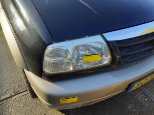 Used Headlight, right Suzuki Grand Vitara I (FT/GT/HT) 2.0 16V Price € 50,00 Margin scheme offered by Yellow Parts