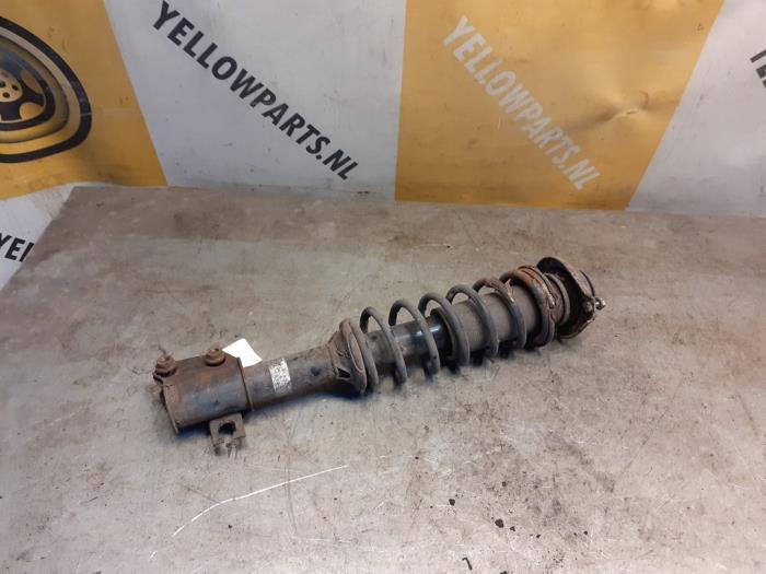 Front shock absorber rod, left from a Suzuki Ignis (FH) 1.3 16V 2002