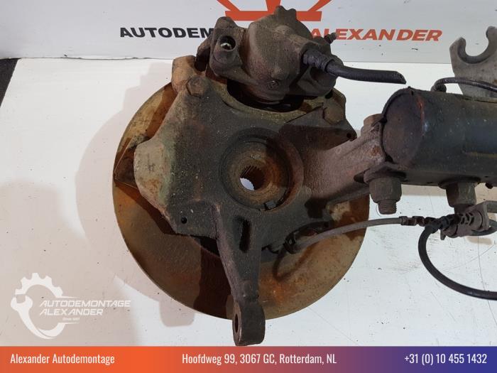 Knuckle, front right from a Renault Megane III Grandtour (KZ) 1.5 dCi 110 2012