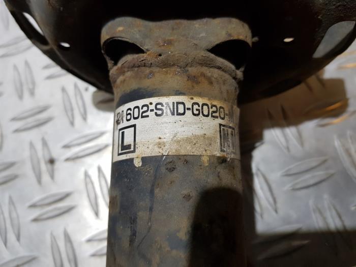Fronts shock absorber, left from a Honda Civic (FA/FD) 1.3 Hybrid 2008