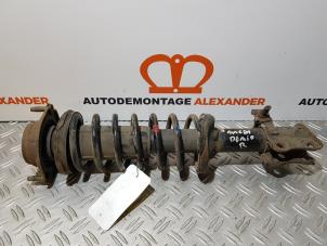 Used Front shock absorber, right Mazda Demio (DW) 1.3 16V Price on request offered by Alexander Autodemontage