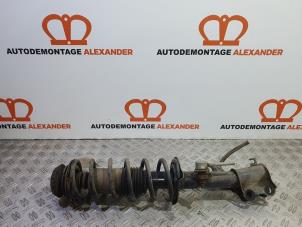 Used Fronts shock absorber, left Nissan Micra (K13) 1.2 12V Price on request offered by Alexander Autodemontage