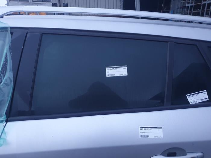 Rear door window 4-door, left from a Renault Megane III Grandtour (KZ) 1.4 16V TCe 130 2010