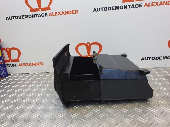 Storage box under front seat, left from a Volkswagen Polo V (6R) 1.6 TDI 16V 90 2011