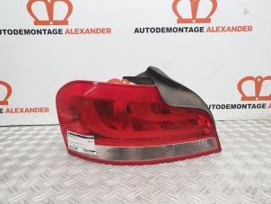 Used Taillight, left BMW 1 serie (E82) 118d 16V Price on request offered by Alexander Autodemontage