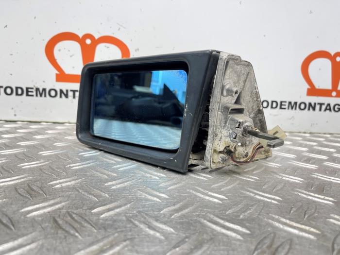 Wing mirror, left from a Mercedes-Benz 190 D (W201) 2.5 D 1986