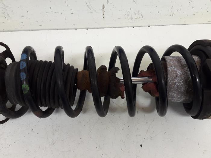 Rear shock absorber, left from a Audi 80 (B3) 1.8 1987