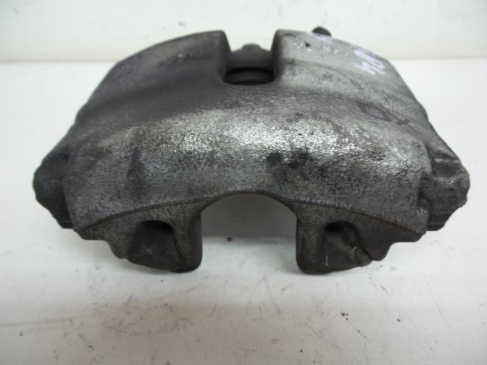 Front brake calliper, left from a Audi A1 Sportback (8XA/8XF) 1.4 TFSI Cylinder on demand 16V 2014