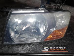Used Headlight, left Mitsubishi Pajero Price € 26,25 Margin scheme offered by Schoones Transmissies B.V.