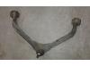 Front upper wishbone, left from a Jeep Cherokee 2004