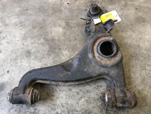 Used Front lower wishbone, left Mercedes 190 (W201) 2.0 Price on request offered by Tijdeman Mercedes Onderdelen