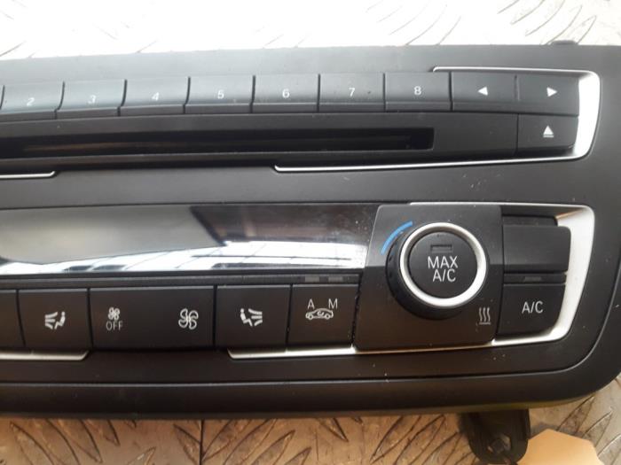 Heater control panel from a BMW 1 serie (F20) 114d 1.6 16V 2015