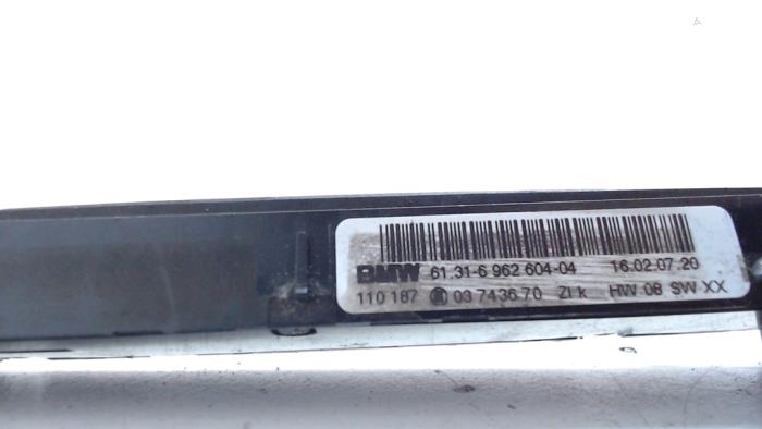 Interruptor de calefactor de asiento de un BMW 3 serie (E90) 325d 24V 2007