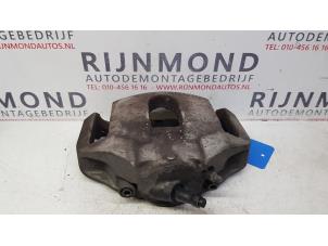 Used Front brake calliper, left BMW 5 serie (E60) 520i 24V Price on request offered by Autodemontage Rijnmond BV