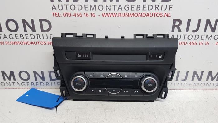 Heater control panel from a Mazda 3 (BM/BN) 2.0 SkyActiv-G 120 16V 2018