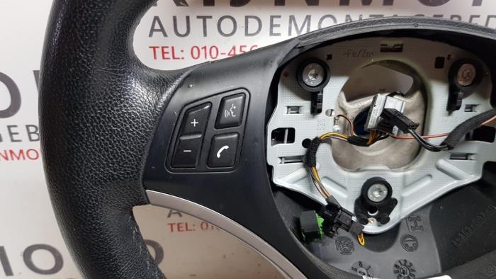 Steering wheel from a BMW X1 (E84) xDrive 18d 2.0 16V 2010