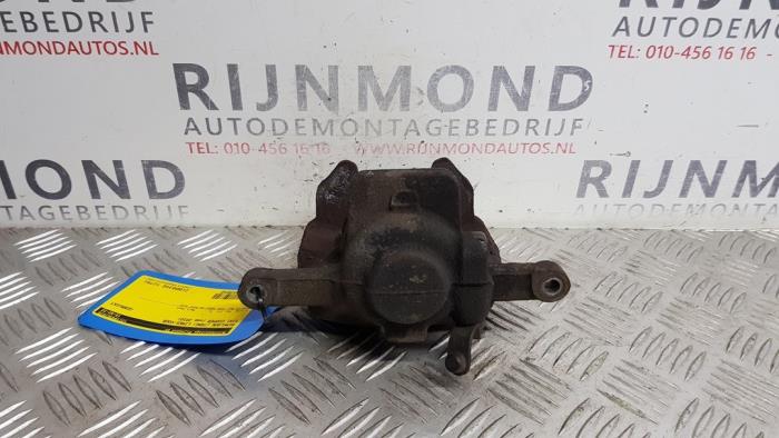 Front brake calliper, left from a MINI Mini (R56) 1.6 16V One 2010