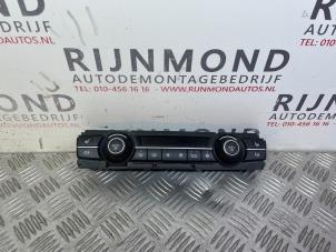 Używane Panel sterowania nagrzewnicy BMW X5 (E70) xDrive 40d 3.0 24V Cena € 60,50 Z VAT oferowane przez Autodemontage Rijnmond BV