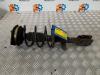 Fronts shock absorber, left from a Renault Clio III Estate/Grandtour (KR), 2007 / 2014 1.2 16V TCE 100, Combi/o, Petrol, 1.149cc, 74kW (101pk), FWD, D4F784; D4FH7, 2007-11 / 2012-12, KR14; KR1P; KRC4; KRCP 2008