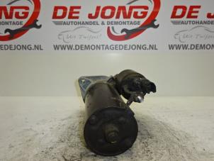 Starter from a Toyota Corolla (E12) 2.0 D-4D 16V 110 2003