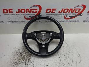 Used Steering wheel Mazda 6 (GG12/82) 2.0i 16V Price € 28,99 Margin scheme offered by Autodemontagebedrijf de Jong