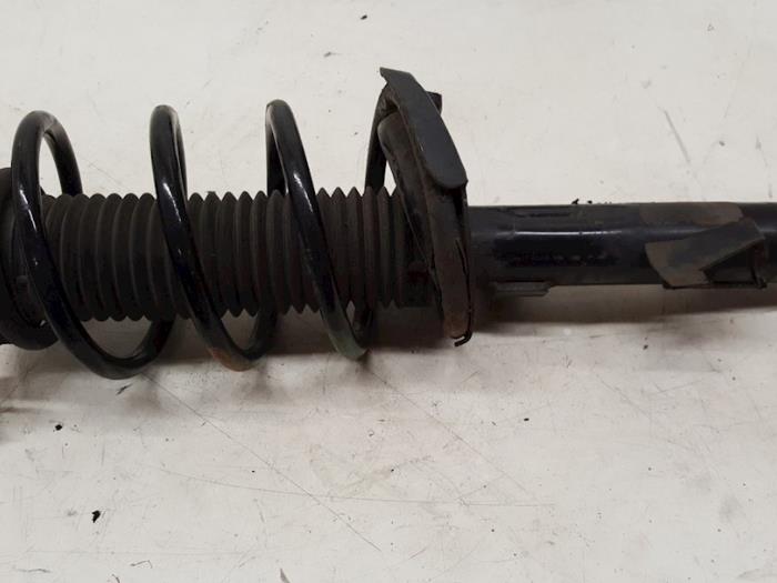 Fronts shock absorber, left from a Ford C-Max (DM2) 2.0 TDCi 16V 2007