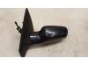 Wing mirror, left from a Renault Clio III (BR/CR) 1.4 16V 2006