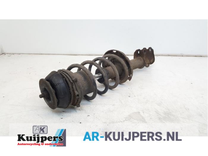 Fronts shock absorber, left from a Opel Corsa C (F08/68) 1.3 CDTi 16V 2005