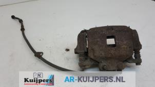 Used Front brake calliper, right Mitsubishi L-200 2.5 DI-D 4x4 Price € 45,00 Margin scheme offered by Autorecycling Kuijpers