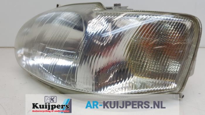 Headlight, left from a Ford Escort 6 (AAL/ABL) 1.6 16V 1996