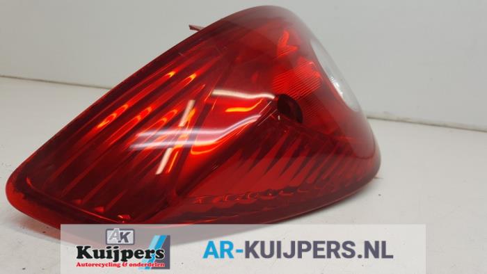 Taillight, left from a Opel Corsa D 1.4 16V Twinport 2006