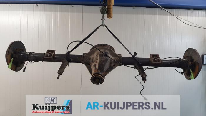 Rear axle beam with reducer