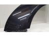 Front wing, left from a Chevrolet Cruze (300) 1.8 16V VVT 2010