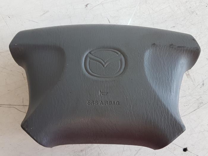 Left airbag (steering wheel) from a Mazda Demio 2000