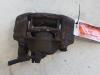 Front brake calliper, left from a Mazda Demio (DW) 1.3 16V 2001