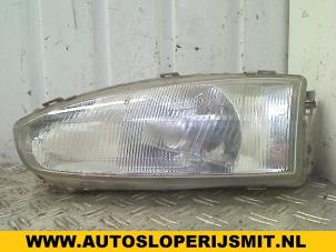 Used Headlight, left Mitsubishi Colt (CA/CC) 1.6 i GL,GLX 16V Price on request offered by Autodemontagebedrijf Smit